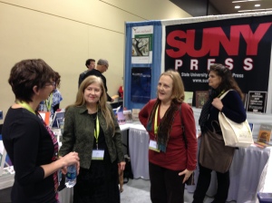 Jo Pitkin, Gwynn O'Gara, and Nancy Avery Dafoe at the SUNY Press booth for the Lost Orchard signing